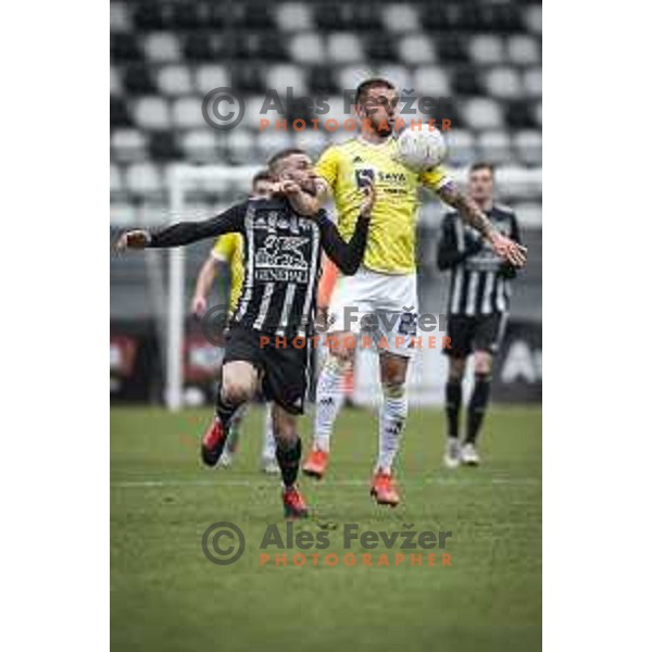 Nino Kouter vs Jan Mlakar in action during Prva liga Telekom Slovenije football match between Mura and Maribor in Fazanerija, Murska Sobota, Slovenia on March 14, 2021
