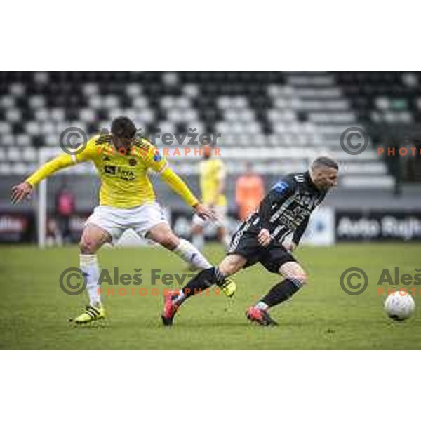 Rok Kronaveter and Nino Kouter in action during Prva liga Telekom Slovenije football match between Mura and Maribor in Fazanerija, Murska Sobota, Slovenia on March 14, 2021