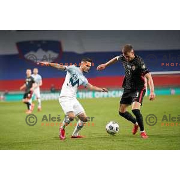 Petar Stojanovic and Borna Barisic in action during FIFA World Cup Qualifying round match between Slovenia and Croatia in Ljubljana, Slovenia on March 24, 2021