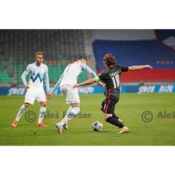 Josip Ilicic and Luka Modric in action during FIFA World Cup Qualifying round match between Slovenia and Croatia in Ljubljana, Slovenia on March 24, 2021
