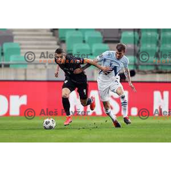 Ivan Perisic and Miha Blazic in action during FIFA World Cup Qualifying round match between Slovenia and Croatia in Ljubljana, Slovenia on March 24, 2021