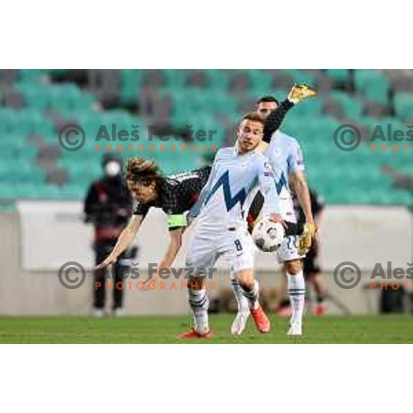 Luka Modric and Sandi Lovric in action during FIFA World Cup Qualifying round match between Slovenia and Croatia in Ljubljana, Slovenia on March 24, 2021