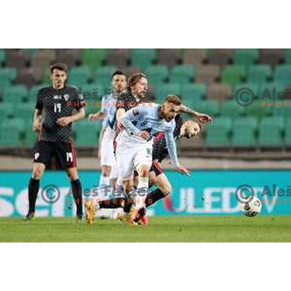 Luka Modric and Sandi Lovric in action during FIFA World Cup Qualifying round match between Slovenia and Croatia in Ljubljana, Slovenia on March 24, 2021