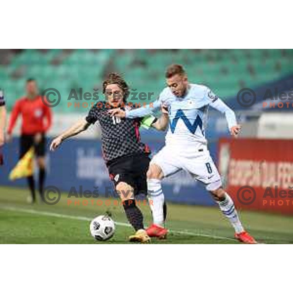 Luka Modric and Sandi Lovric in action during FIFA World Cup Qualifying round match between Slovenia and Croatia in Ljubljana, Slovenia on March 24, 2021
