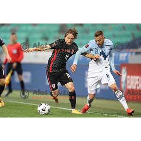 Luka Modric and Sandi Lovric in action during FIFA World Cup Qualifying round match between Slovenia and Croatia in Ljubljana, Slovenia on March 24, 2021