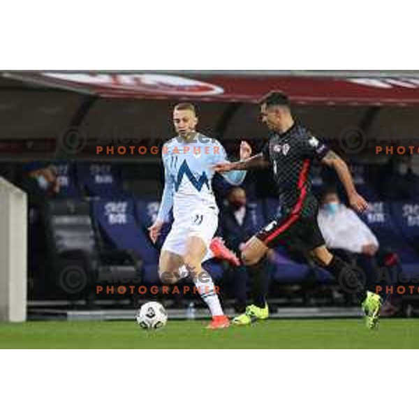 Blaz Kramer and Dejan Lovren in action during FIFA World Cup Qualifying round match between Slovenia and Croatia in Ljubljana, Slovenia on March 24, 2021