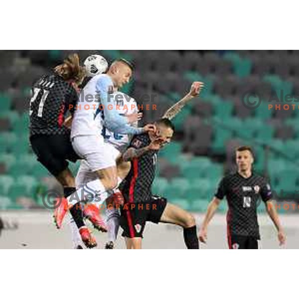 Domagoj Vida, Blaz Kramer and Marcelo Brozovic in action during FIFA World Cup Qualifying round match between Slovenia and Croatia in Ljubljana, Slovenia on March 24, 2021