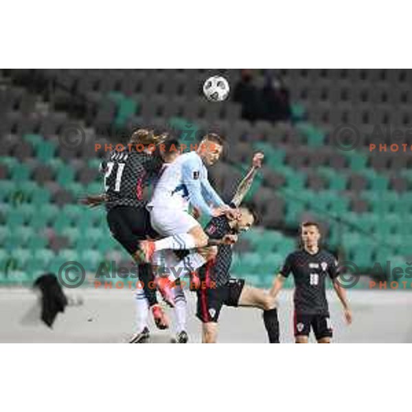 Domagoj Vida, Blaz Kramer and Marcelo Brozovic in action during FIFA World Cup Qualifying round match between Slovenia and Croatia in Ljubljana, Slovenia on March 24, 2021