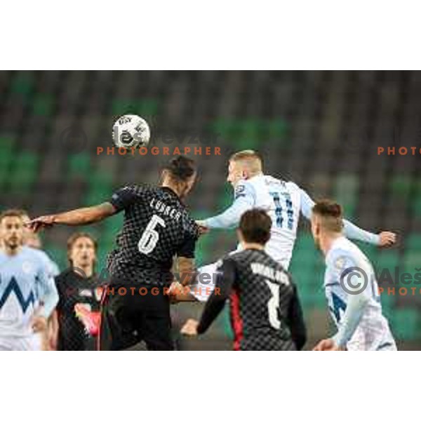 Dejan Lovren and Blaz Kramer in action during FIFA World Cup Qualifying round match between Slovenia and Croatia in Ljubljana, Slovenia on March 24, 2021