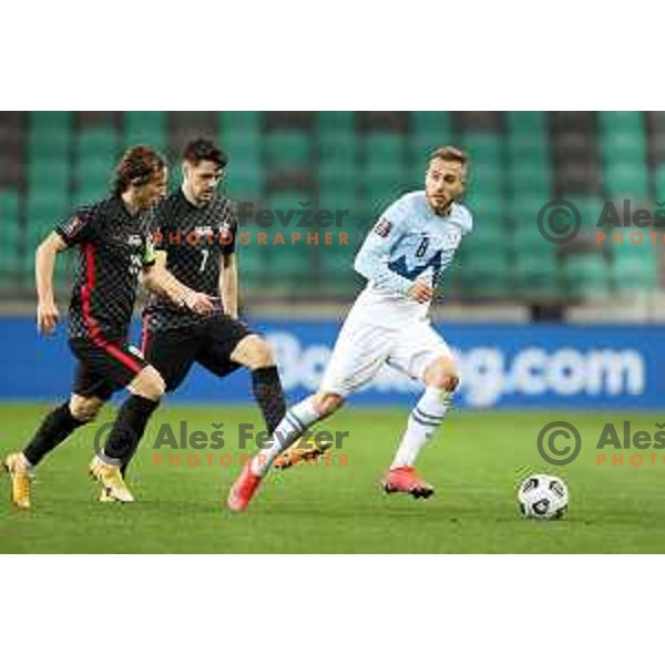 Luka Modric and Sandi Lovric in action during FIFA World Cup Qualifying round match between Slovenia and Croatia in Ljubljana, Slovenia on March 24, 2021