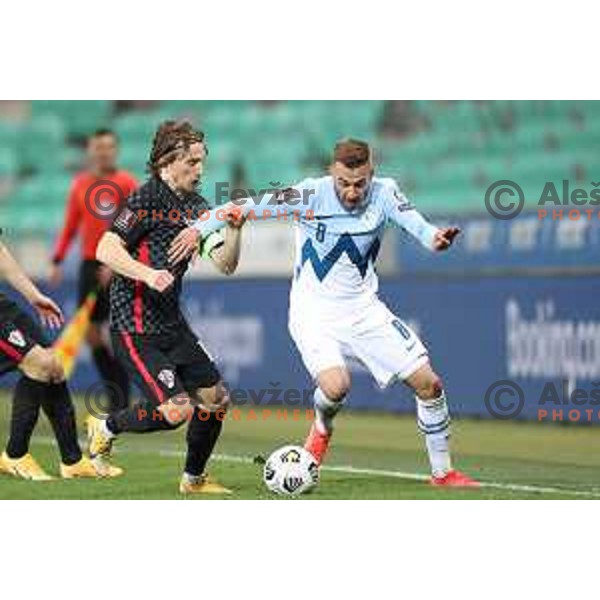 Luka Modric and Sandi Lovric in action during FIFA World Cup Qualifying round match between Slovenia and Croatia in Ljubljana, Slovenia on March 24, 2021