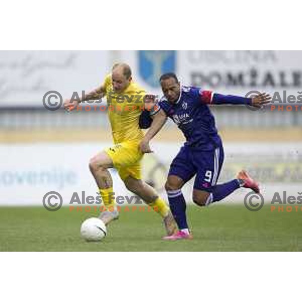 Senijad Ibricic and Marcos Tavares in action during Pivovarna Union Slovenian Cup football match between Domzale and Maribor in Domzale, Slovenia on April 27, 2021