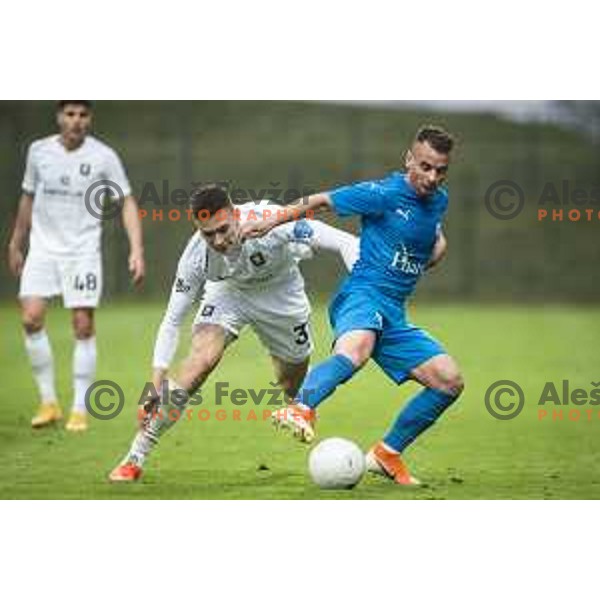 Enrik Ostrc vs Vedran Vinko in action during Pivovarna Union Slovenian cup football match between Nafta 1903 and Olimpija Ljubljana in Lendava, Slovenia on April 28, 2021