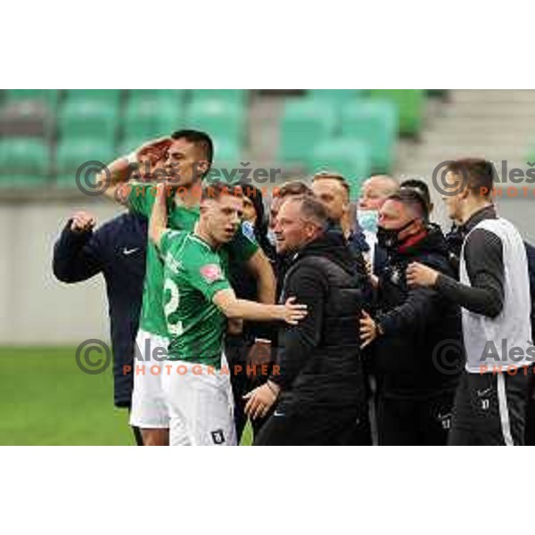 Vujadin Savic, Michael Pavlovic and Goran Stankovic, head coach of Olimpija celebrate goal during Prva Liga Telekom Slovenije 2020-2021 football match between Olimpija and Aluminij in SRC Stozice, Ljubljana, Slovenia on May 2, 2021