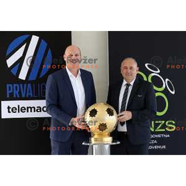 Adrian Jezina of Telemach and Radenko Mijatovic of NZS pose after signing an sponsorship contract for Prva liga Telemach 2021-2022 at NNC Brdo, Slovenia on July 1, 2021