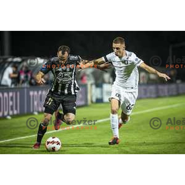 Ziga Kous vs Michael Pavlovic in action during Prva liga Telemach football match between Mura and Olimpija in Fazanerija, Murska Sobota, Slovenia on September 11, 2021