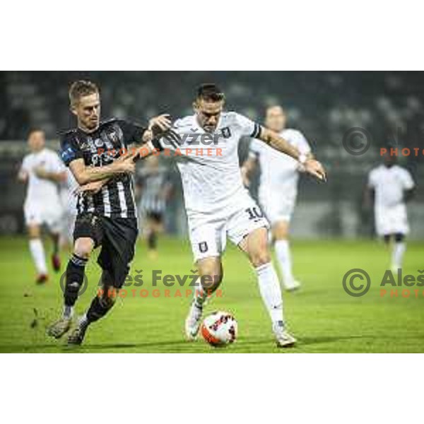 Zan Karnicnik vs Timi Max Elsnik in action during Prva liga Telemach football match between Mura and Olimpija in Fazanerija, Murska Sobota, Slovenia on September 11, 2021
