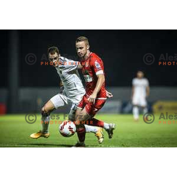 Danijel Sturm vs Gasper Pecnik in action during Prva liga Telemach football match between Aluminij and Maribor in Sportni park Aluminij, Kidricevo, Slovenia on September 12, 2021