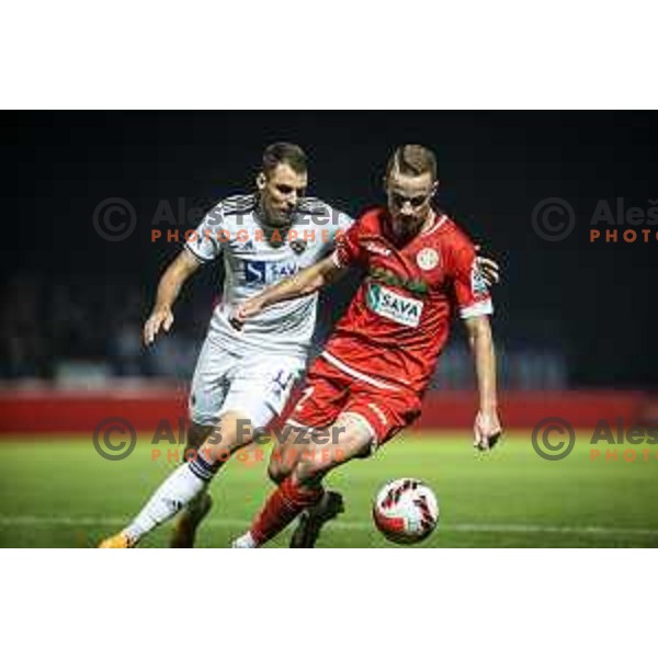Danijel Sturm vs Gasper Pecnik in action during Prva liga Telemach football match between Aluminij and Maribor in Sportni park Aluminij, Kidricevo, Slovenia on September 12, 2021