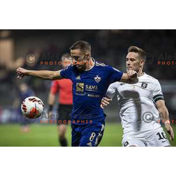Marko Alvir vs Timi Max Elsnik in action during Prva Liga Telemach football match between Maribor and Olimpija in Maribor, Slovenia on October 2, 2021