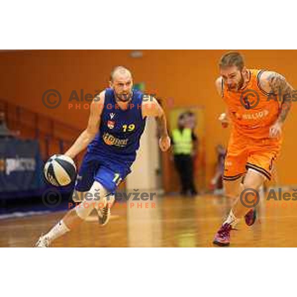 Miha Vasl and Miroslav Pasaljic in action during Nova KBM league basketball match between Helios Suns and Hopsi Polzela in Domzale, Slovenia on October 2, 2021
