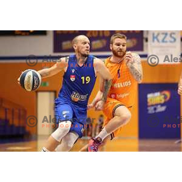 Miha Vasl and Miroslav Pasaljic in action during Nova KBM league basketball match between Helios Suns and Hopsi Polzela in Domzale, Slovenia on October 2, 2021