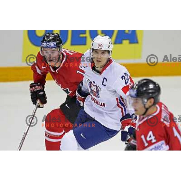 Marcel Rodman (22) of Slovenia and Jonathan Toews (16) of Canada at IIHF World championship 2008 preliminary round group B, played in Halifax, Nova Scotia, Canada May 2nd 2008. Canada beat Slovenia 5:1. Photo by Ales Fevzer 
