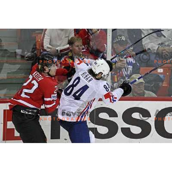 Hebar (84) of Slovenia and Keith (22) of Canada at IIHF World championship 2008 preliminary round group B, played in Halifax, Nova Scotia, Canada May 2nd 2008. Canada beat Slovenia 5:1. Photo by Ales Fevzer 