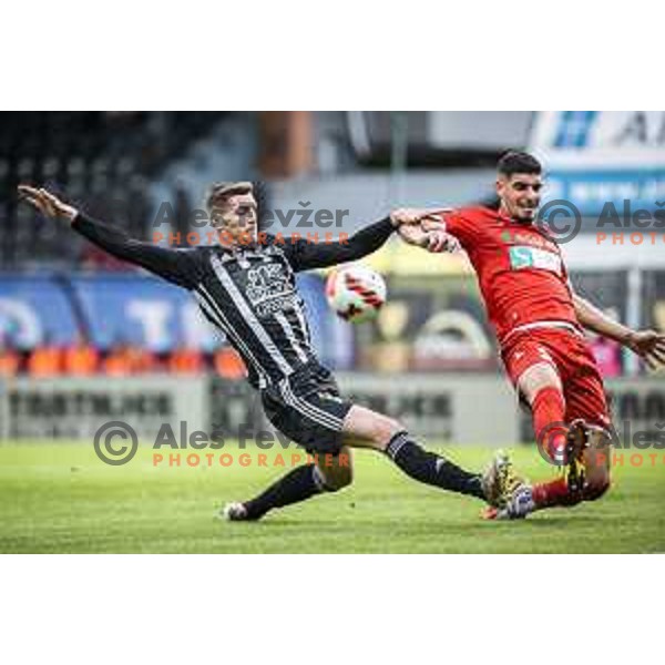 Nardin Mulahusejnovic vs Emir Azemovic in action during Prva liga Telemach football match between Mura and Aluminij in Fazanerija, Murska Sobota, Slovenia on October 16, 2021
