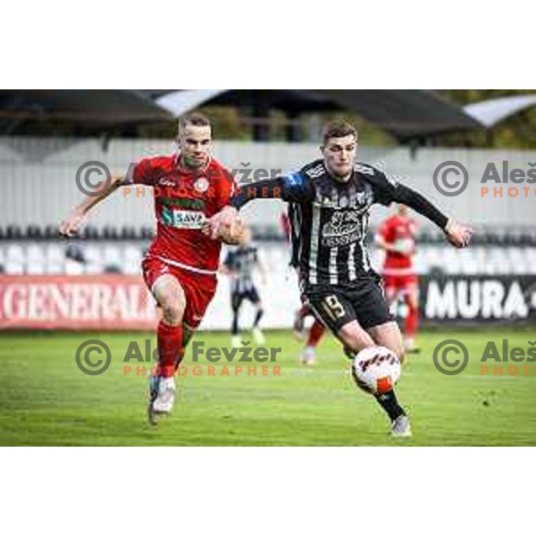 Gasper Pecnik vs Nardin Mulahusejnovic in action during Prva liga Telemach football match between Mura and Aluminij in Fazanerija, Murska Sobota, Slovenia on October 16, 2021