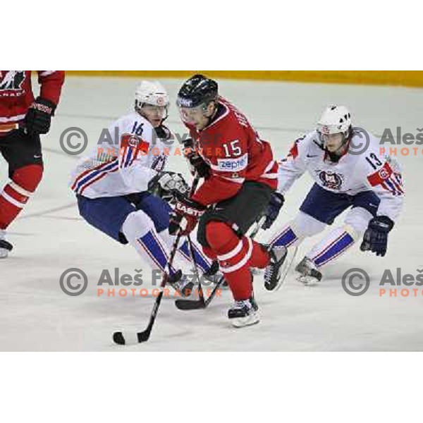 Music (16) and Pajic (13) of Slovenia and Heatley (15) of Canada at IIHF World championship 2008 preliminary round group B, played in Halifax, Nova Scotia, Canada May 2nd 2008. Canada beat Slovenia 5:1. Photo by Ales Fevzer 