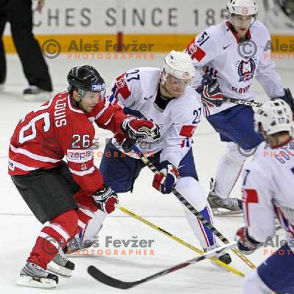 Miha Rebolj (27) of Slovenia and Martin St.Louis (26) of Canada at IIHF World championship 2008 preliminary round group B, played in Halifax, Nova Scotia, Canada May 2nd 2008. Canada beat Slovenia 5:1. Photo by Ales Fevzer 