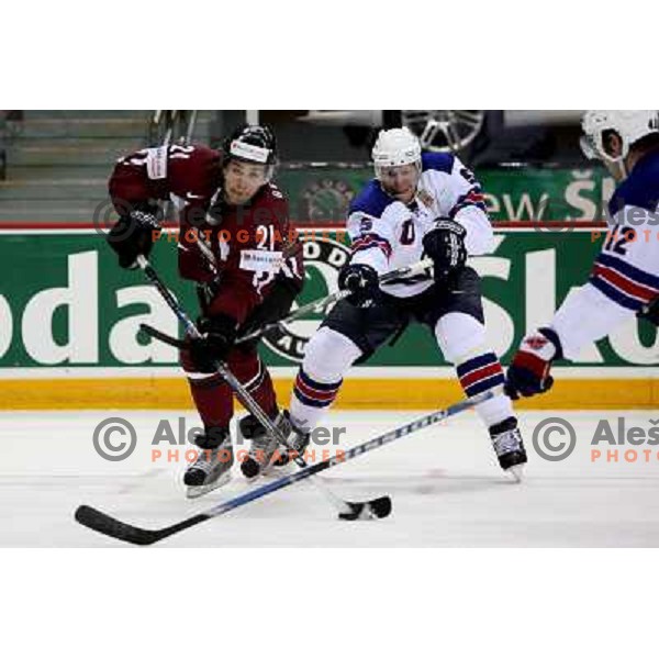 Greene (5) of USA and Berzins (21) of Latvia at IIHF World championship 2008 preliminary round group B, played in Halifax, Nova Scotia, Canada May 2nd 2008. USA beat Latvia 4:0. Photo by Ales Fevzer 