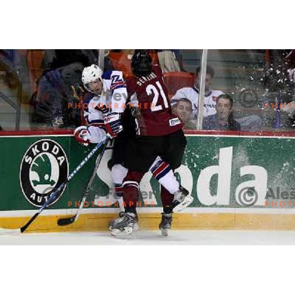 Gilbert (77) of USA and Berzins (21) of Latvia at IIHF World championship 2008 preliminary round group B, played in Halifax, Nova Scotia, Canada May 2nd 2008. USA beat Latvia 4:0. Photo by Ales Fevzer 