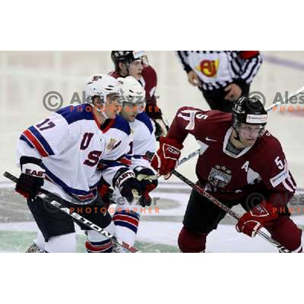 Parise (17) of USA and Sprutks (5) of Latvia at IIHF World championship 2008 preliminary round group B, played in Halifax, Nova Scotia, Canada May 2nd 2008. USA beat Latvia 4:0. Photo by Ales Fevzer 