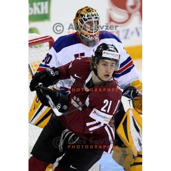 Thomas (30) of USA and Berzins (21) of Latvia at IIHF World championship 2008 preliminary round group B, played in Halifax, Nova Scotia, Canada May 2nd 2008. USA beat Latvia 4:0. Photo by Ales Fevzer 
