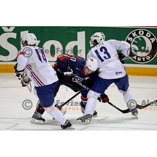 Parise (17) of USA and Pretnar (14) and Pajic (13) of Slovenia at IIHF World championship 2008 preliminary round group B, played in Halifax, Nova Scotia, Canada May 4th 2008. USA beat Slovenia 5:1. Photo by Ales Fevzer 