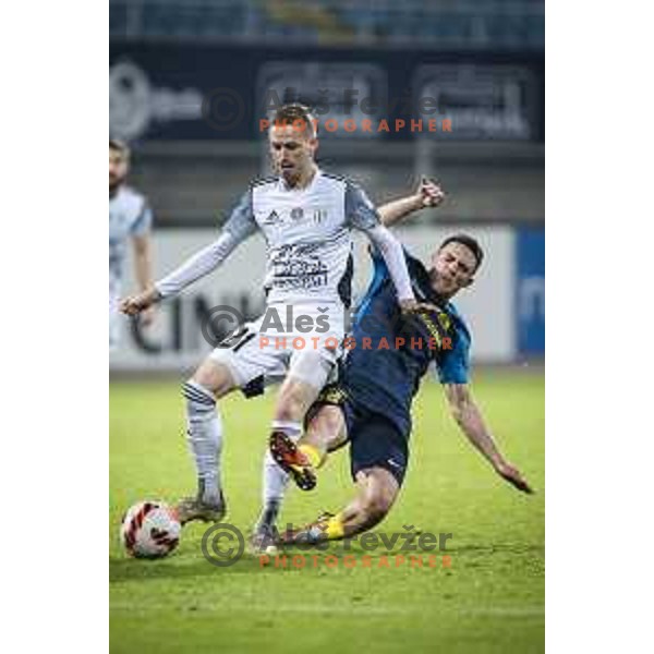 Zan Karnicnik vs Tamar Svetlin in action during Prva liga Telemach football match between Celje and Mura in Arena z’dezele, Celje, Slovenia on October 31, 2021. Photo: Jure Banfi/www.alesfevzer.com