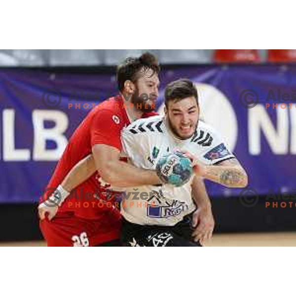 Ziga Stopar and Veljko Stanojevic in action during 1.NLB league handball match between Grosist Slovan and Trimo Trebnje in Kodeljevo Hall, Ljubljana, Slovenia on November 5, 2021