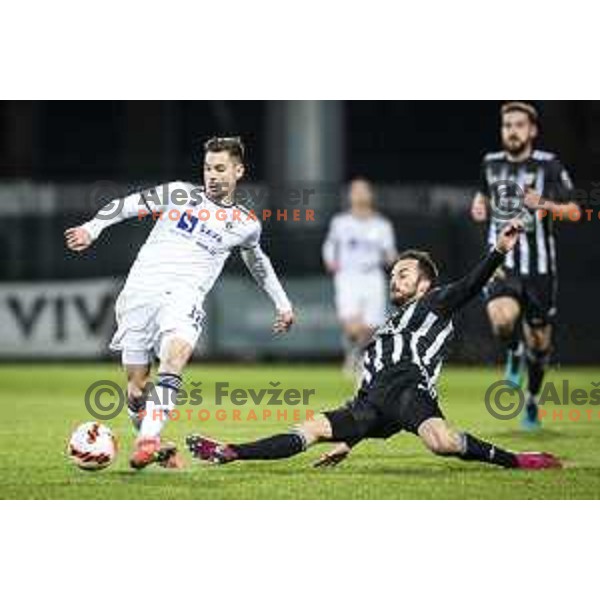 Gregor Sikosek vs Ziga Kous in action during Prva liga Telemach football match between Mura and Maribor in Fazanerija, Murska Sobota, Slovenia on November 28, 2021. Photo: Jure Banfi/www.alesfevzer.com