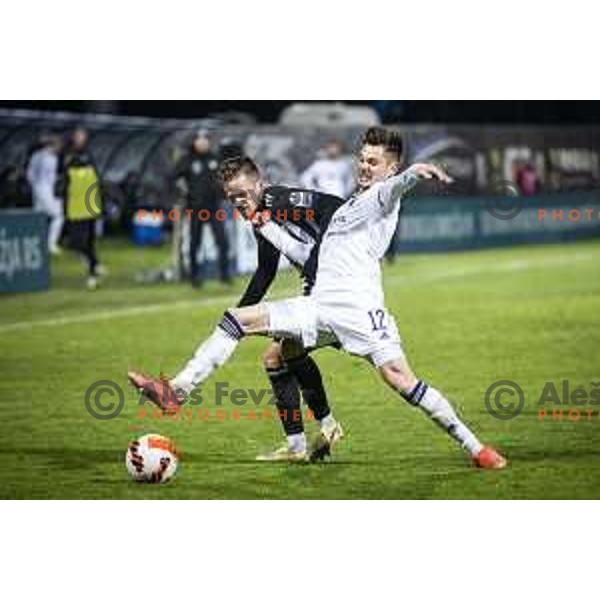 Tomi Horvat vs Gregor Sikosek in action during Prva liga Telemach football match between Mura and Maribor in Fazanerija, Murska Sobota, Slovenia on November 28, 2021. Photo: Jure Banfi/www.alesfevzer.com