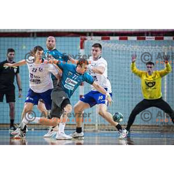 Anze Blagotinsek and Izidor Budja vs Marin Buneta in action during Slovenian Cup handball match between Maribor Branik and Riko Ribnica in Luknja, Maribor, Slovenia on December 15, 2021. Photo: Jure Banfi/www.alesfevzer.com