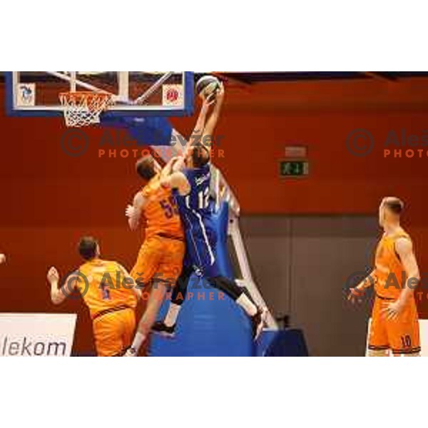 Leon Santelj blocks Sandi Cebular during Nova KBM league match between Helios Suns and Terme Olimia Podcetrtek in Domzale, Slovenia on January 22, 2022
