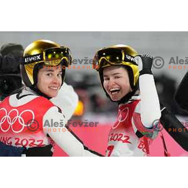 Ursa Bogataj and Nika Kriznar of Slovenia Women’s Ski jumping Olympic team celebrate gold and bronze medal at Normal Hill in Zhangjiakou venue of Beijing 2022 Winter Olympic Games, China on February 5, 2022