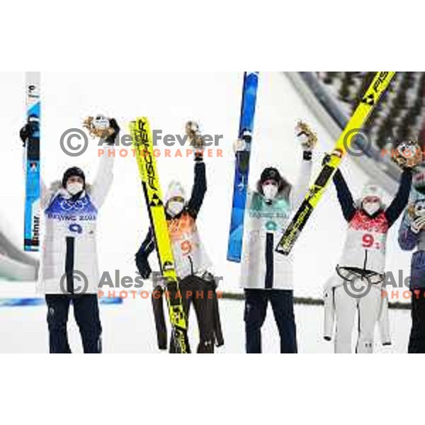 Nika Kriznar, Timi Zajc, Ursa Bogataj and Peter Prevc of Slovenia Ski jumping Olympic team, gold medal winners at Mix Team Competition in Zhangjiakou venue of Beijing 2022 Winter Olympic Games, China on February 7, 2022