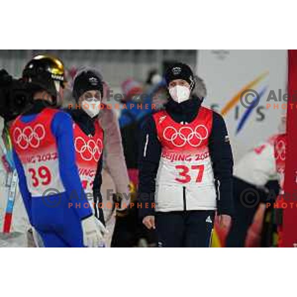 Timi Zajc, Cene Prevc and Lovro Kos (SLO) react after the final jump at Ski Jumping Normal Hill Competition in Zhangjiakou venue of Beijing 2022 Winter Olympic Games, China on February 12, 2022