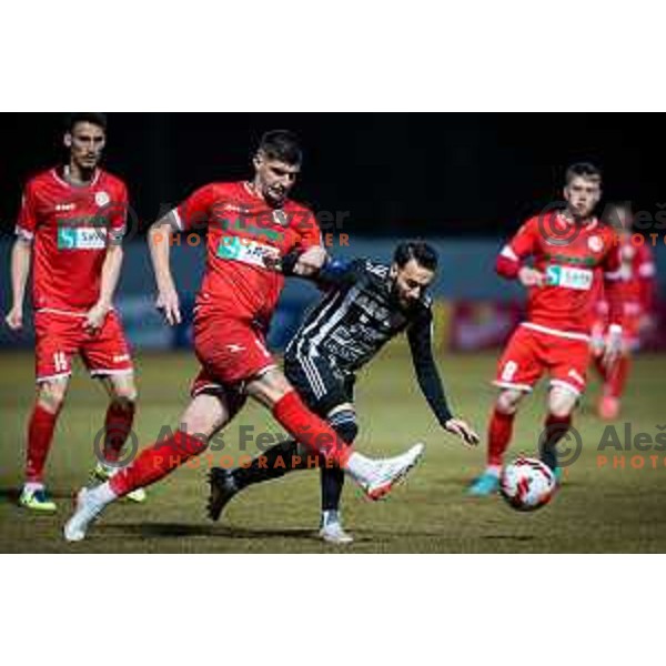 Emir Azemovic vs Mitja Lotric in action during Prva liga Telemach football match between Aluminij and Mura in Sportni park Kidricevo, Slovenia, on February 19, 2022. Photo: Jure Banfi/www.alesfevzer.com