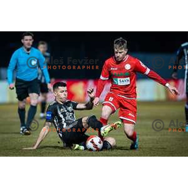 Mirlind Daku vs Nik Marinsek in action during Prva liga Telemach football match between Aluminij and Mura in Sportni park Kidricevo, Slovenia, on February 19, 2022. Photo: Jure Banfi/www.alesfevzer.com