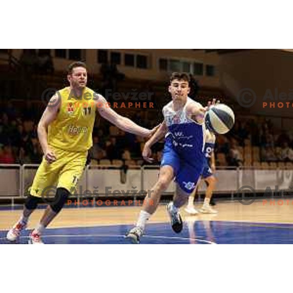 Marko Vranjkovic and Rok Nemanic in action during Nova KBM league basketball match between Hopsi and Sentjur in Polzela, Slovenia on April 2, 2022