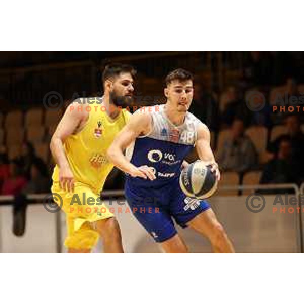Jan Rizman and Rok Nemanic in action during Nova KBM league basketball match between Hopsi and Sentjur in Polzela, Slovenia on April 2, 2022